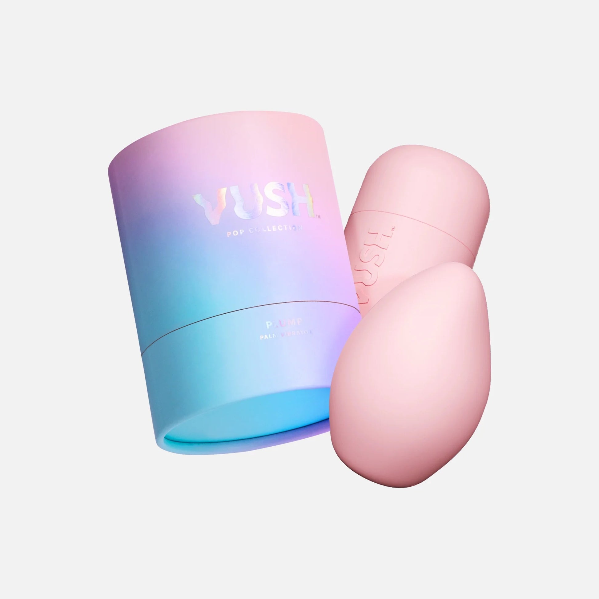 VUSH Plump Palm Vibrator in Pink Friday colourway in front of pink case, next to pink/purple/gradient cylinder packaging against light grey background.