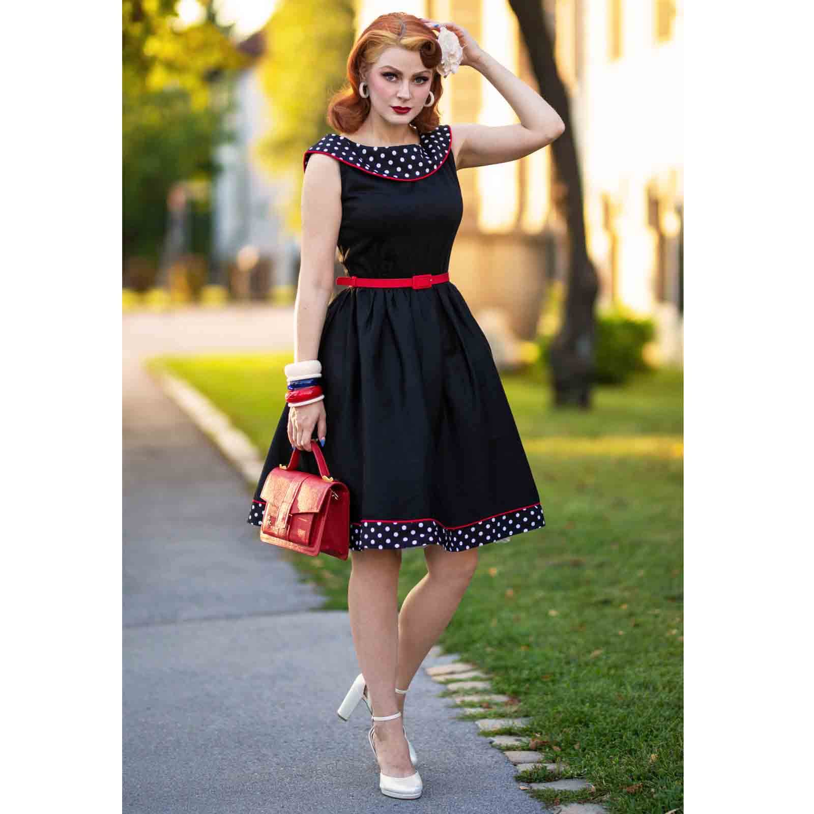 Dolly and Dotty Cindy 50s Dress - Black - model wearing dress with red bag and white heels - full length