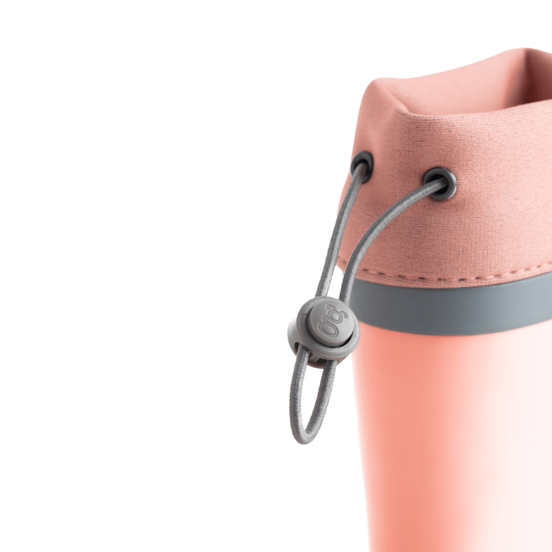 Grubbybub kids gumboots are a good splash above your regular gumboot. Front view with logo and pull string toggles in our pink Just Peachy colour