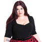 Plus size model with dark hair in a retro style 50s black top