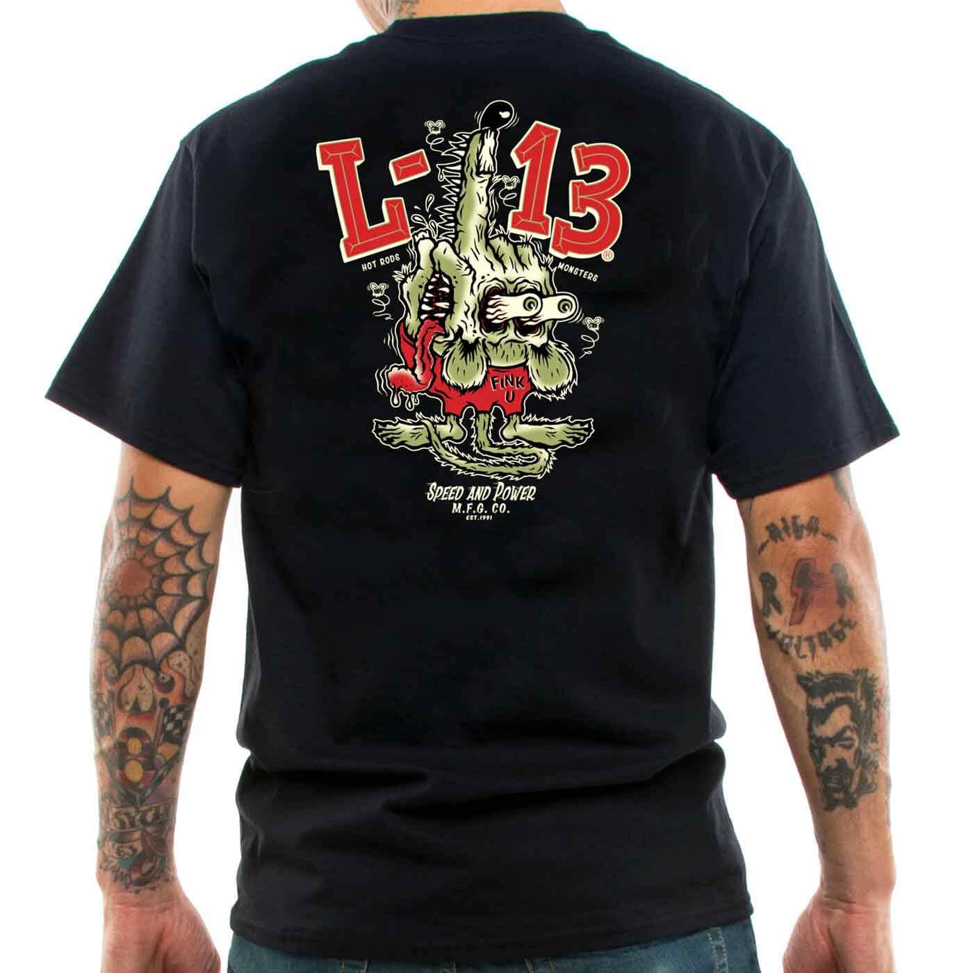 Back view of a tattooed man wearing a lucky 13 t-shirt